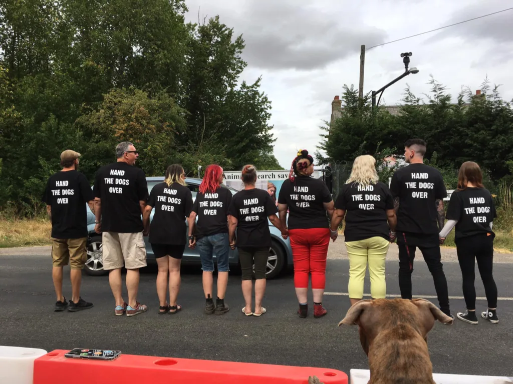 A Camp Beagle protestor has been threatened with a community protection order by Cambridgeshire police for “persistently throwing flowers at vans as they leave MBR Acres”.