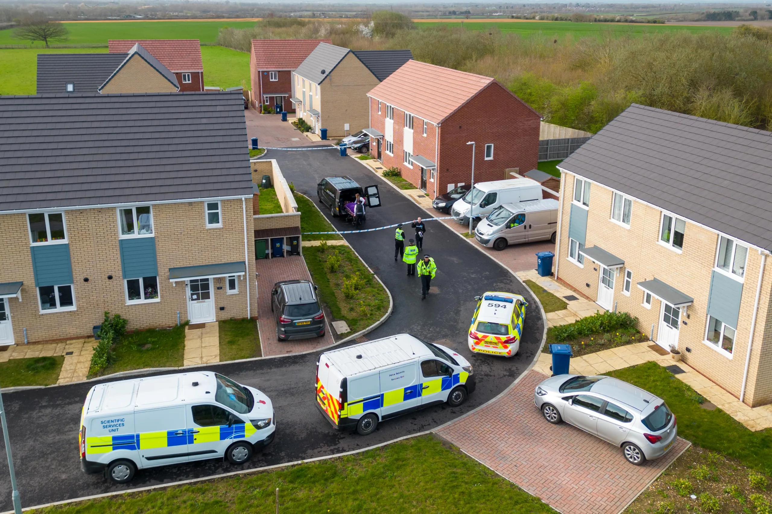 Scene of one of two murders in Cambridgeshire last night: police at a house in Meridian Close, Bluntisham, where the body of one of the victims was found at just after 9pm following reports reports of gunshots.