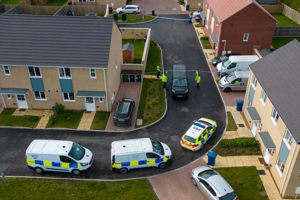 Scene of one of two murders in Cambridgeshire last night: police at a house in Meridian Close, Bluntisham, where the body of one of the victims was found at just after 9pm following reports reports of gunshots.