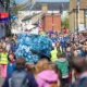 Dubbed ‘Coronation Eel Day’ the spectacular eel focal point snaked its way from Cross Green through the streets to Jubilee Gardens to begin a packed day of events by the river. Picture: TERRY HARRIS