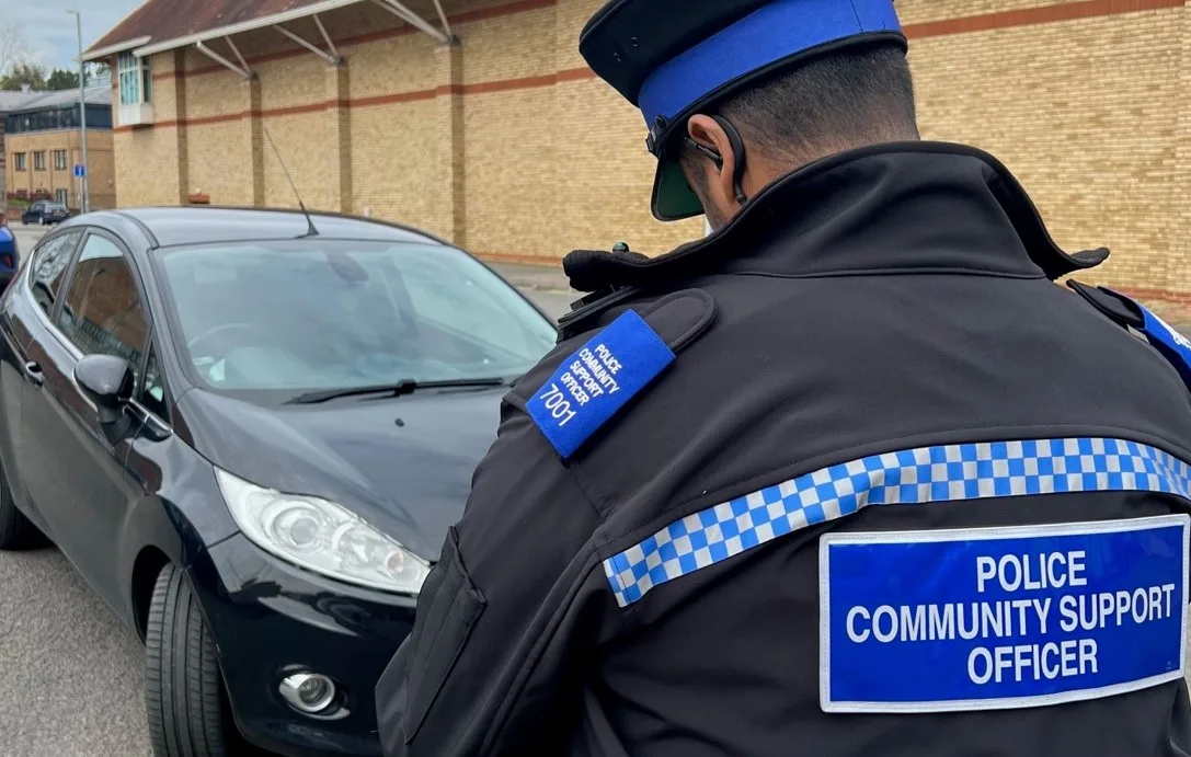 Gotcha! PCSO Ruben Borges gives a motorist a parking ticket in Huntingdon.