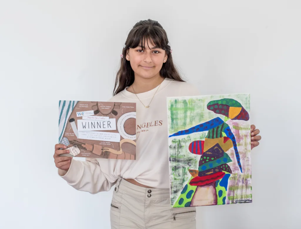 Mia Grewal with her winning painting Lady in a Hat.