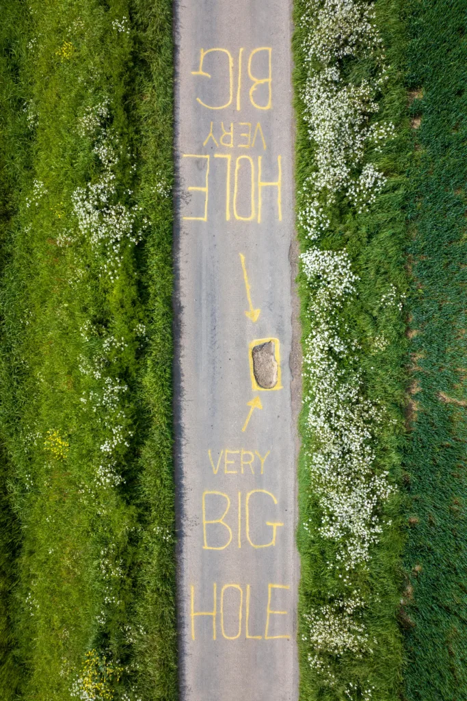 The artistic touch to draw attention to the pothole has appeared at Murrow near Wisbech and could be there for a while. PHOTO: Terry Harris for CambsNews