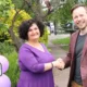 Headteacher Rachel Snape with Cllr Alex Beckett on problematic junction outside the school, posters in the background.