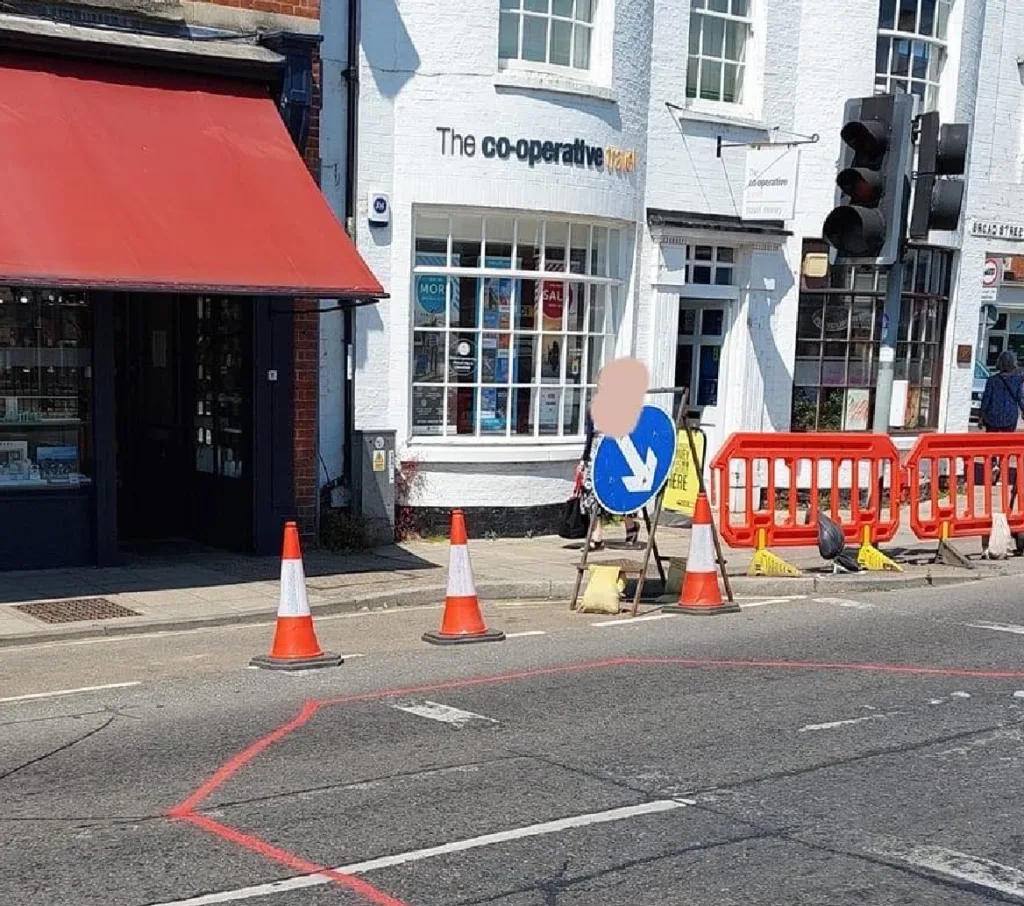 Official photo by Fenland Council (left) showing new position of March Fountain. On the right is the photo produced by Malletts jewellers which they claim shows the true horror of relocating it outside their shop.