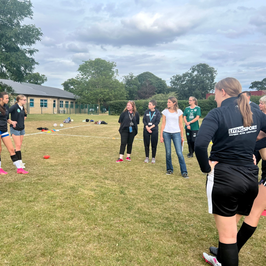 Lucy meeting the Soham Town Ranger U16’s Girls alongside the Living Sport Team 