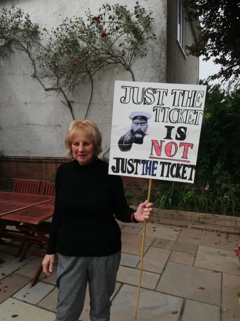 Just the ticket - Angela Singer with her homemade placard. On Thursday, an estimated 1,000 people – one for every ticket office facing closure - marched for the cause. 