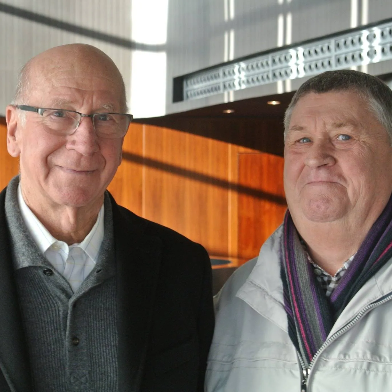 The photo which Pop loved to share – with the late Sir Bobby Charlton, the Manchester United star who played 758 games and scored 249 goals for the club.