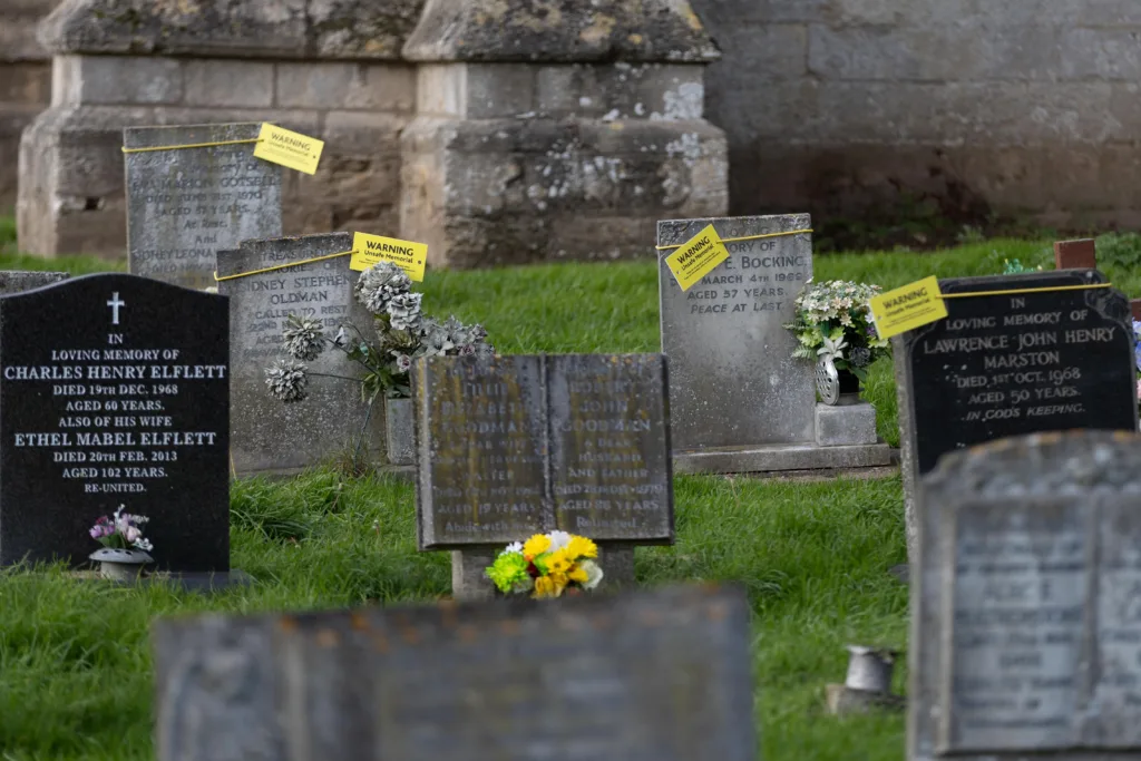 Residents in Terrington St Clement say health and safety has “gone mad” after their local council placed yellow warning tags on gravestones. PHOTO: Terry Harris