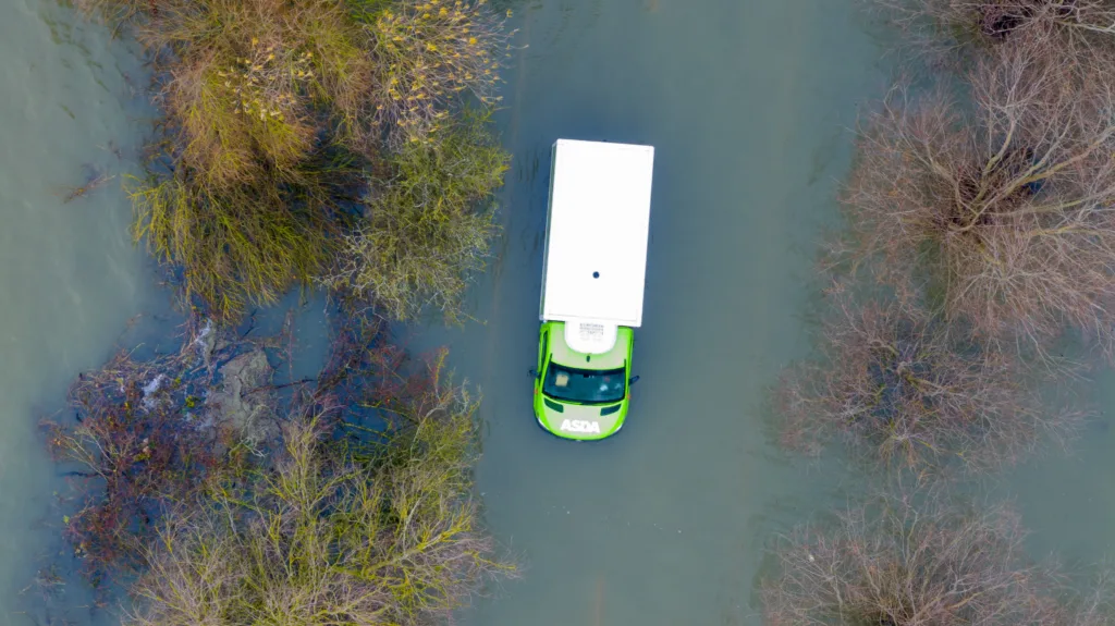 Morning after the night before: The Asda delivery van submerged in water midway through the Welney Wash Road on the A1101 bordering Cambridgeshire and Norfolk. PHOTO: Bav Media 