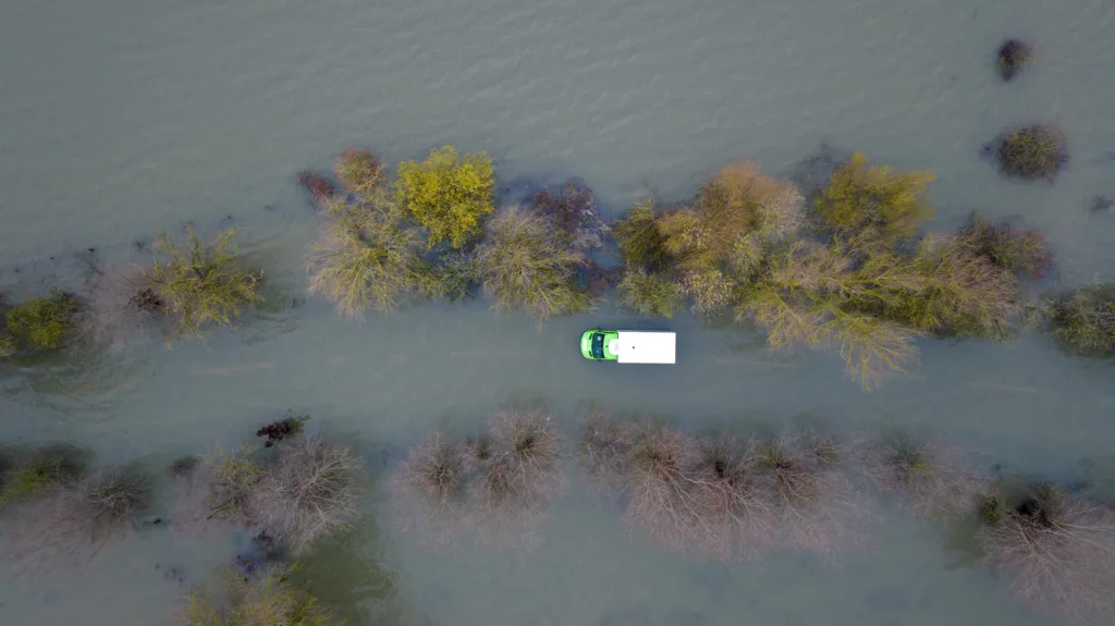 Morning after the night before: The Asda delivery van submerged in water midway through the Welney Wash Road on the A1101 bordering Cambridgeshire and Norfolk. PHOTO: Bav Media 