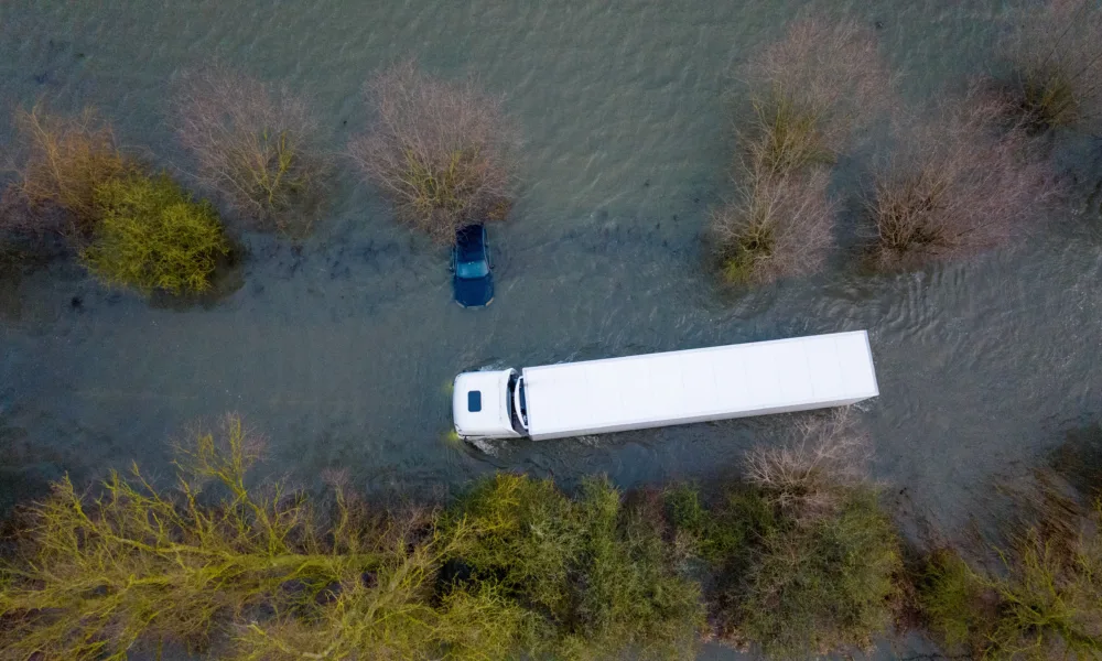 Abandoned car on the flooded A1101 in Welney, Norfolk, on Wednesday morning as the flooding continues after the recent heavy rain. PHOTO: BavMedia 