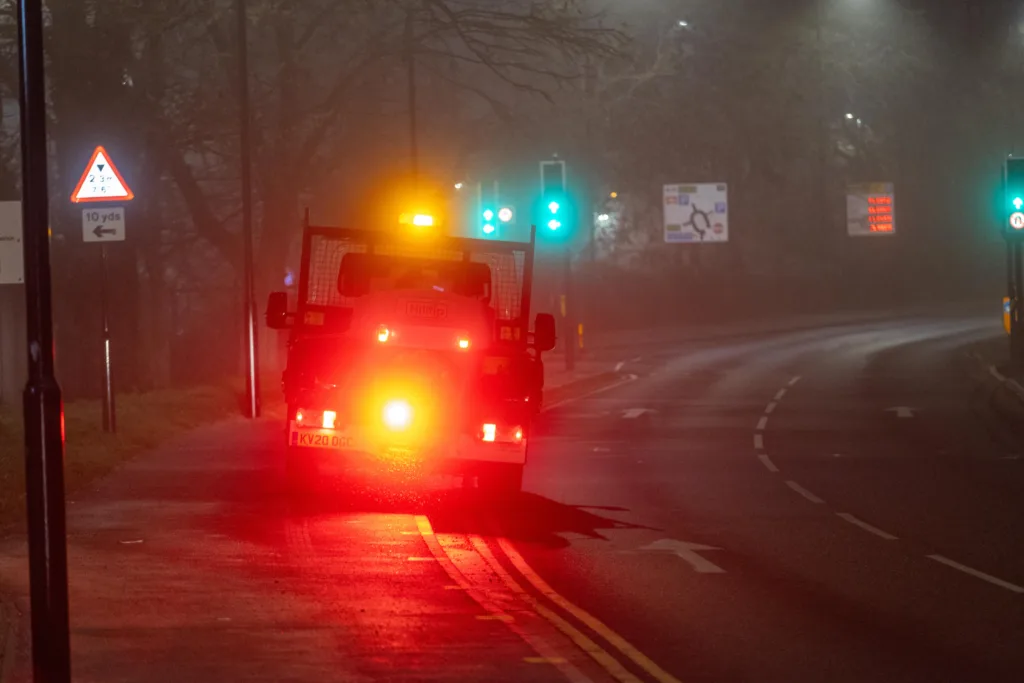 Gritter spotted driving from near TK Maxx to Railway Station Car Park along the path while gritting in the fog and dark.,Bourges Boulevard , Peterborough Saturday 02 December 2023. 