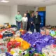 Local organiser, Kate McIntosh (L) and foodbank volunteers with donated hampers