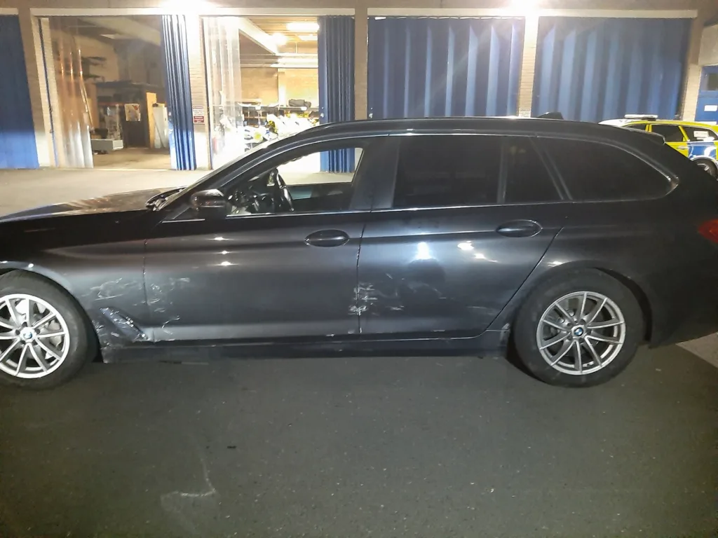 Logan Cook, 22, (centre) jailed after ramming police vehicles (right) and putting lives at risk by failing to stop in Peterborough. His car is on the left.