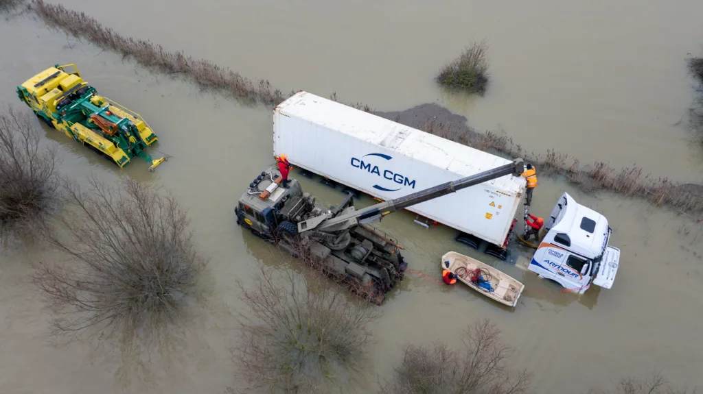 An articulated lorry was finally recovered from a flooded A1101 at Welney in Norfolk today (Thurs) after being stuck in the deep water for four days. PHOTO: Bav Media 