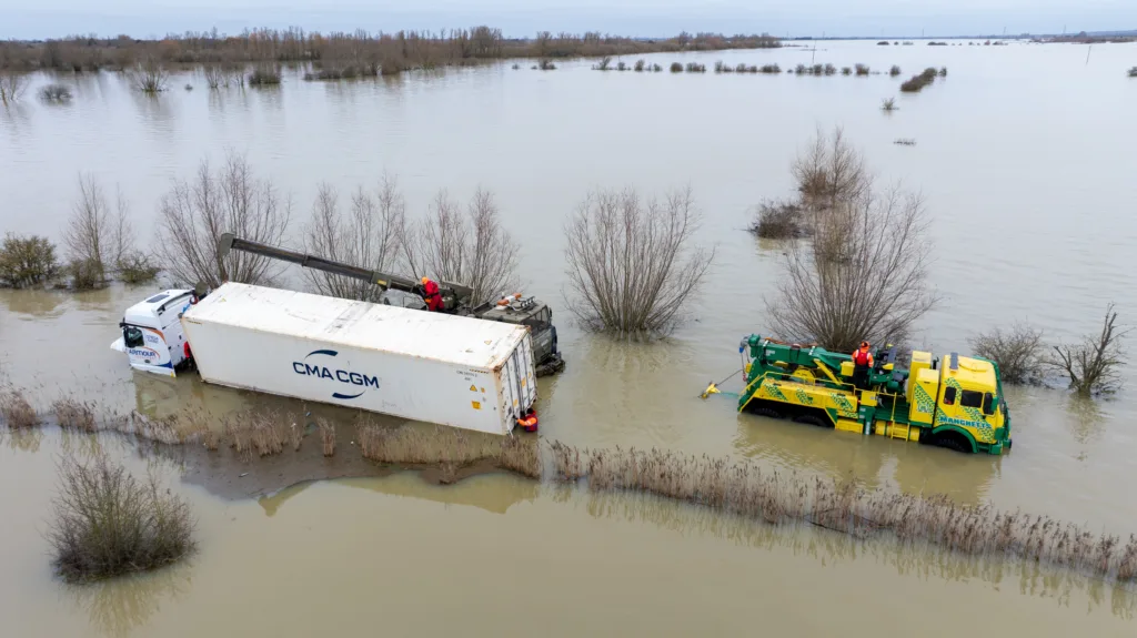 An articulated lorry was finally recovered from a flooded A1101 at Welney in Norfolk today (Thurs) after being stuck in the deep water for four days. PHOTO: Bav Media 