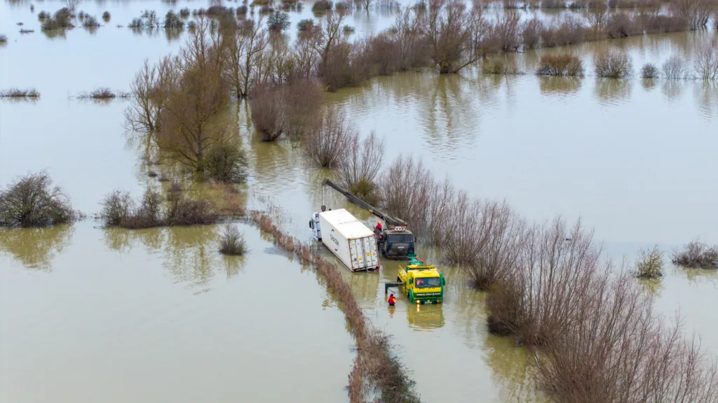 An articulated lorry was finally recovered from a flooded A1101 at Welney in Norfolk today (Thurs) after being stuck in the deep water for four days. PHOTO: Bav Media 