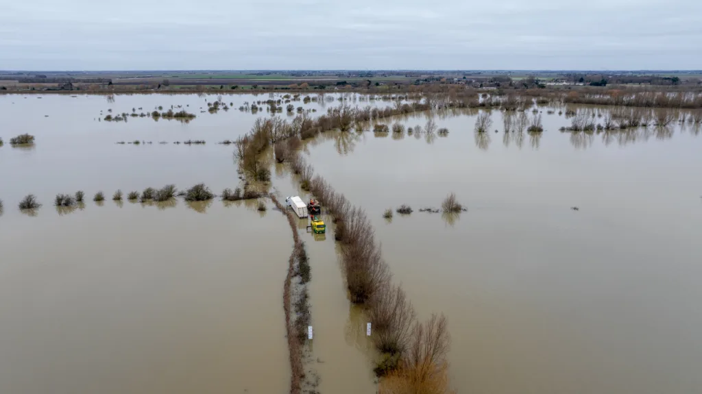 An articulated lorry was finally recovered from a flooded A1101 at Welney in Norfolk today (Thurs) after being stuck in the deep water for four days. PHOTO: Bav Media 