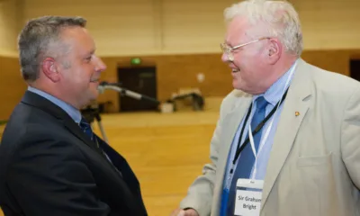 Sir Graham Bright (right) congratulating his successor Jason Ablewhite as police and crime commissioner for Cambridgeshire PHOTO: Terry Harris