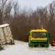 Manchetts staff weighing up the options to rescue lorry and container from flooded A1101 at Welney on the Cambridgeshire/Norfolk border. PHOTO: Terry Harris