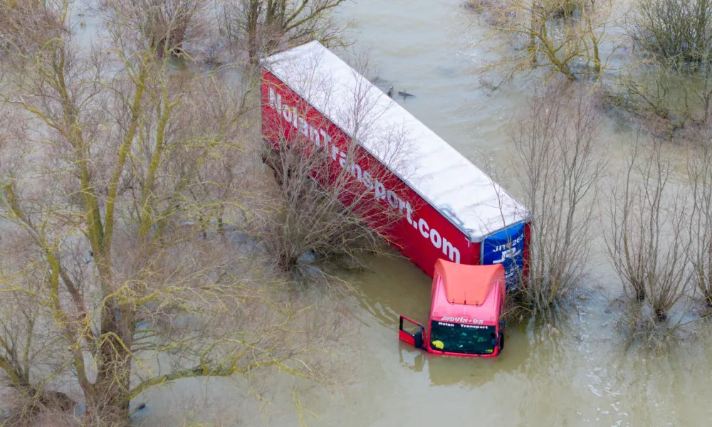 Well and truly stuck: The truck and trailer owned by Nolan Transport that attempted an unsuccessful crossing of Welney Wash road today. PHOTO: Bav Media