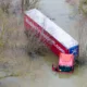 Well and truly stuck: The truck and trailer owned by Nolan Transport that attempted an unsuccessful crossing of Welney Wash road today. PHOTO: Bav Media