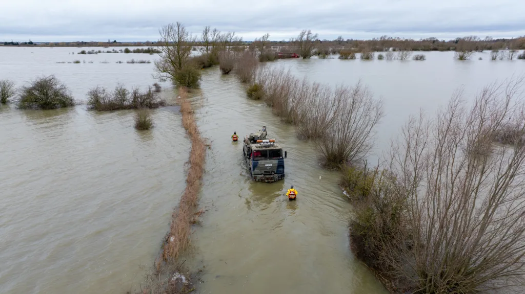 Recovery team from Manchetts were praised for their efforts in retrieving this cab and trailer that the driver was forced to abandon in the early hours of Monday on the flooded A1101 Welney Wash Road. PHOTO: Bav Media 