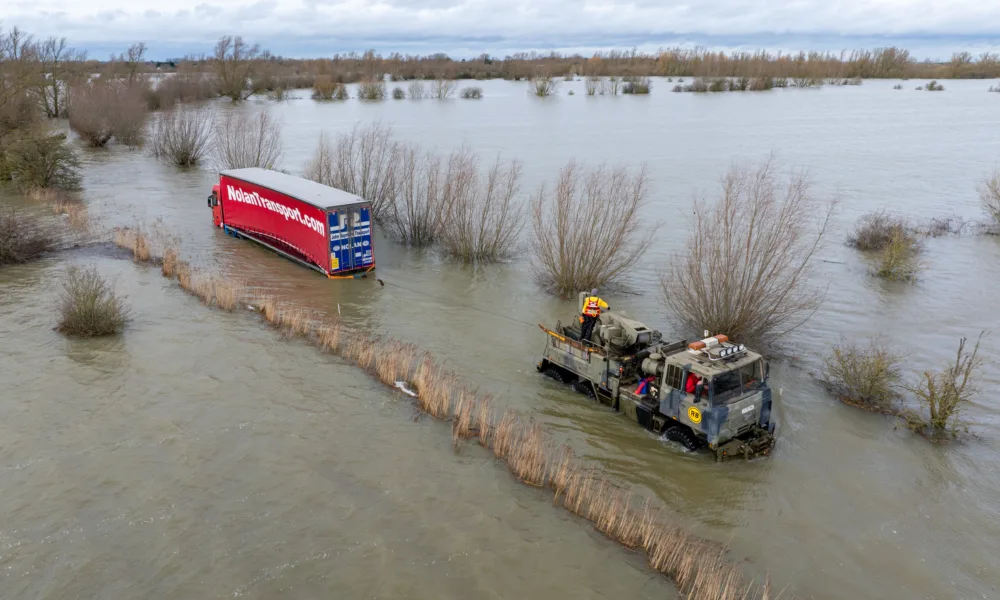 Recovery team from Manchetts were praised for their efforts in retrieving this cab and trailer that the driver was forced to abandon in the early hours of Monday on the flooded A1101 Welney Wash Road. PHOTO: Bav Media