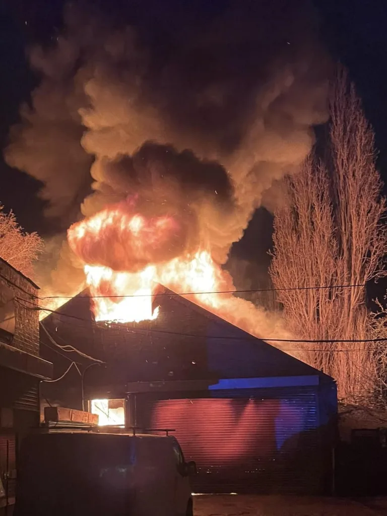 Firefighters tackle a major garage fire in Lincoln Road, Peterborough. Earlier 60 firefighters were called after fire broke out at Lidl distribution centre at Alwalton. PHOTO: Cambridgeshire Fire and Rescue Service
