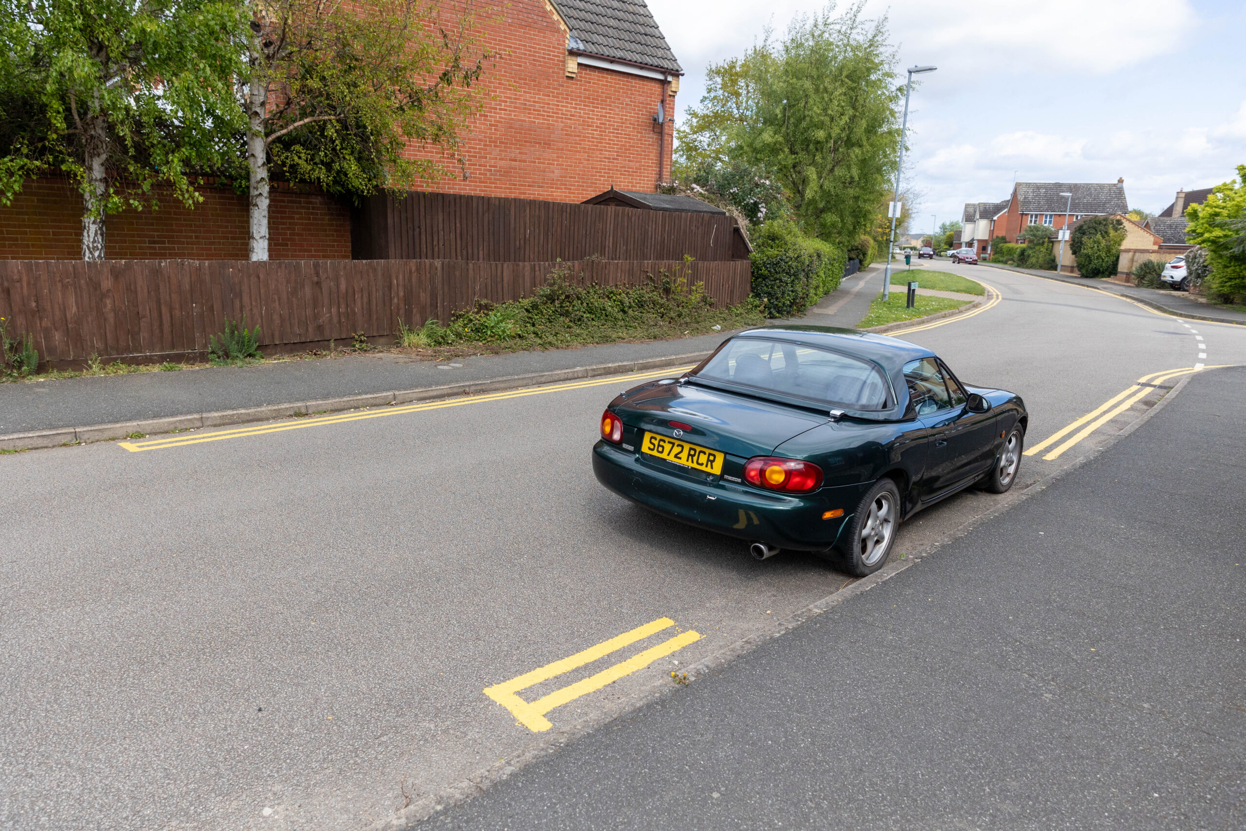 County council contractors plan a return visit to Witchford near Ely to complete installation of yellow lines. They missed some spots because cars were parked there when they came to carry out the lining. PHOTO: Terry Harris