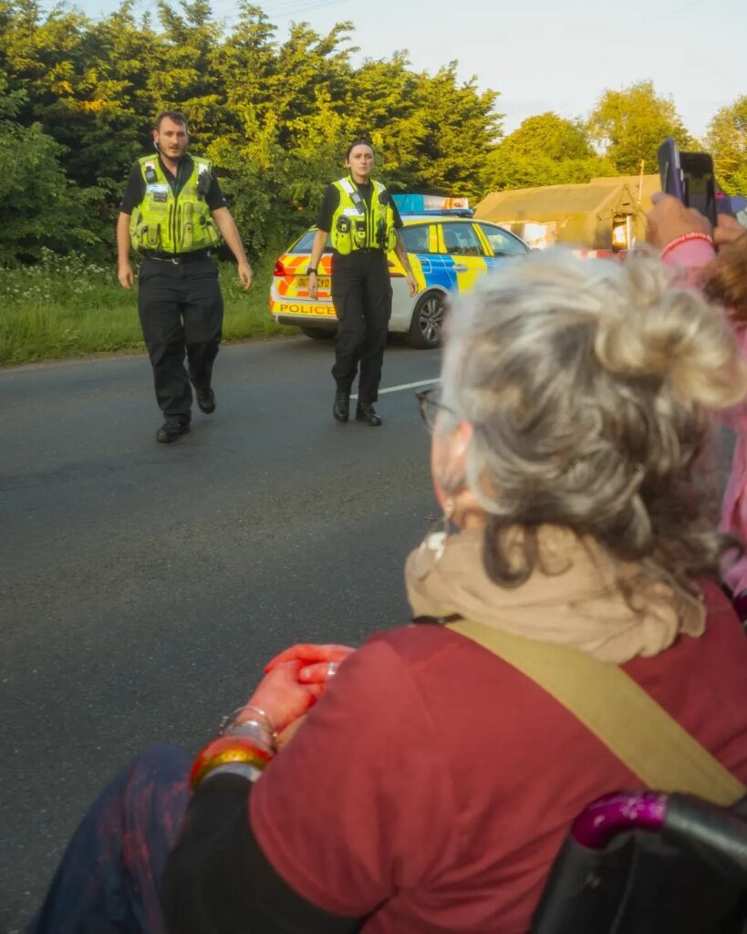 Tímea Kovács, a photographer working on a documentary photo project with Camp Beagle took this photo of Louise Ryan and her wheelchair protest.