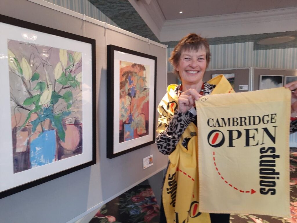 Cathy Parker wearing a shawl made of the yellow Open Studio flag