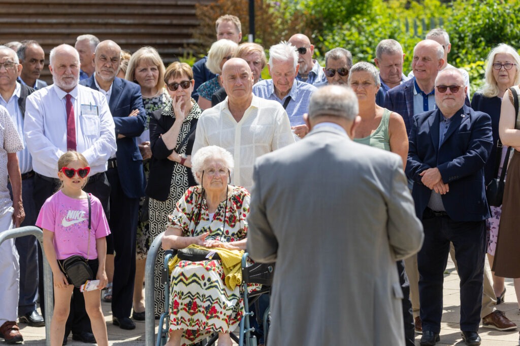 A plaque to commemorate Charles Swift after a square was named in his honour was unveiled today by his widow Brenda. Brenda was joined by close family and friends and many councillors Including the Mayor Marco Cereste who hosted the event. Charles Swift Square, Peterborough Thursday 27 June 2024. Picture by Terry Harris.