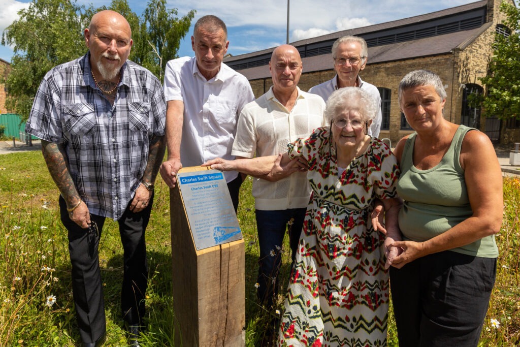 A plaque to commemorate Charles Swift after a square was named in his honour was unveiled today by his widow Brenda. Brenda was joined by close family and friends and many councillors Including the Mayor Marco Cereste who hosted the event. Charles Swift Square, Peterborough Thursday 27 June 2024. Picture by Terry Harris.