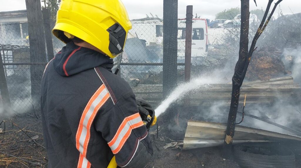 An electricity pylon in Oldfield Lane Wisbech caught fire after being used to illegally abstract power to run a cannabis factory in a neighbouring scrapyard. A second cannabis factory elsewhere was discovered. PHOTO: Policing Fenland/Cambs Fire and Rescue 
